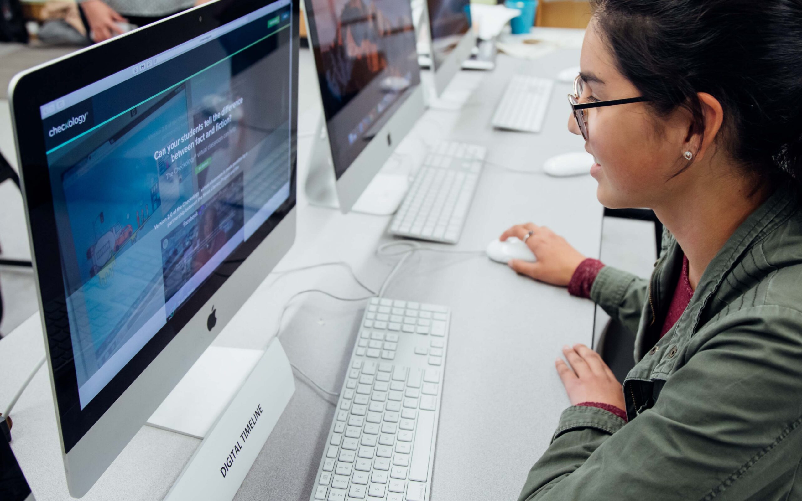 Checkology student at computer.