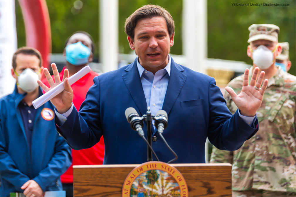 Image of Florida Govenor Ron Desantis speaking behind a podium at a press conference held April 17, 2020