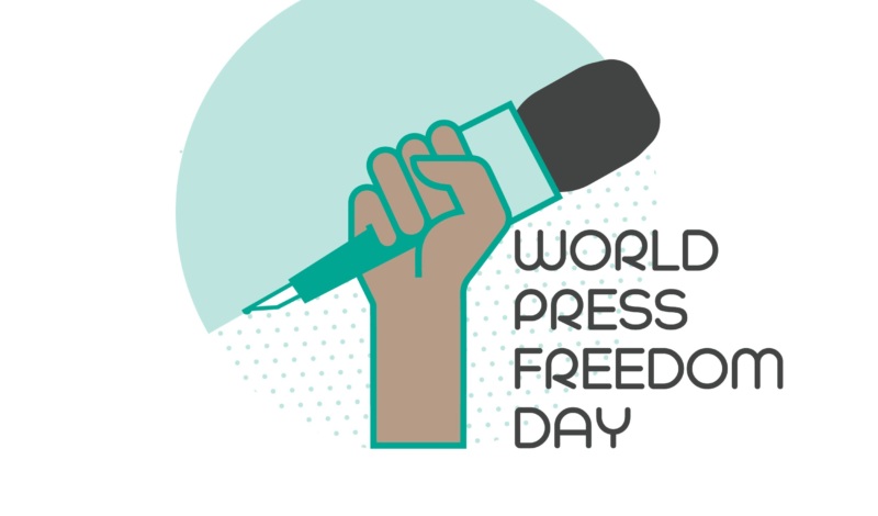 world press freedom day illustration with a hand holding up a microphone