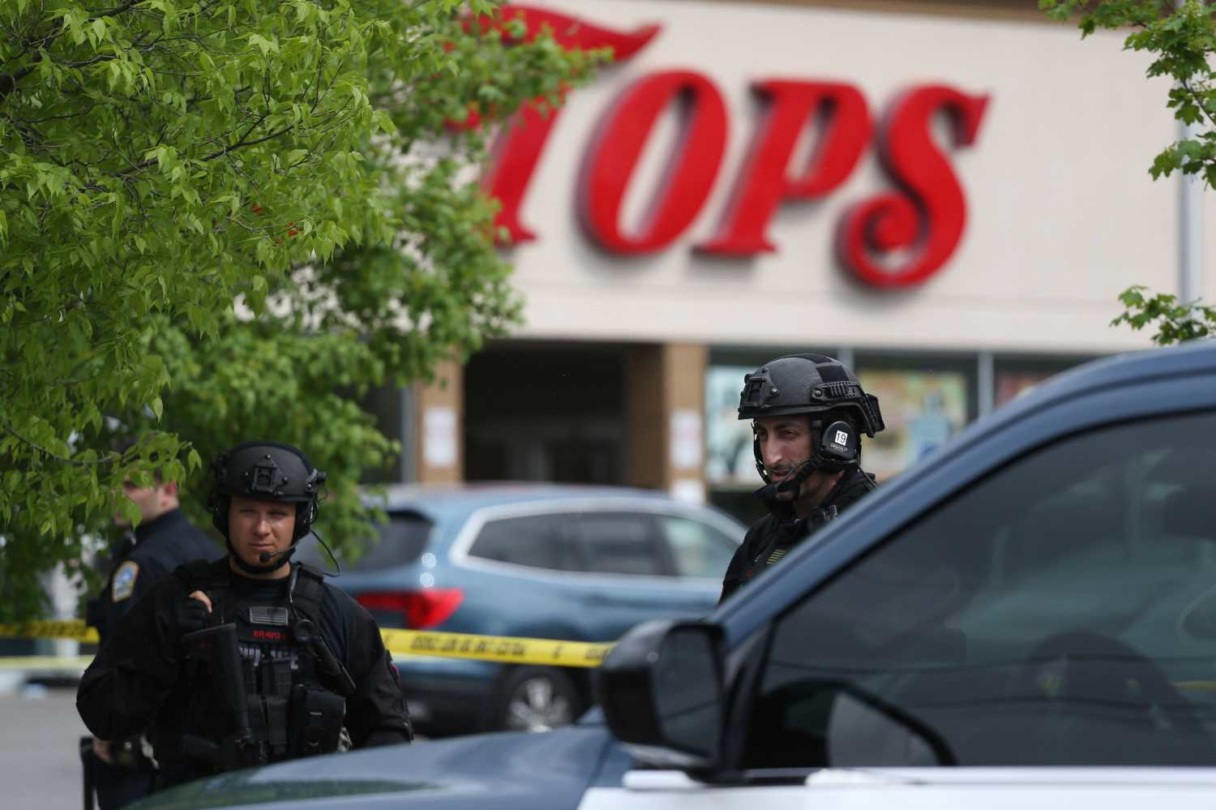 Police secure a perimeter after a shooting at a supermarket, in Buffalo, N.Y