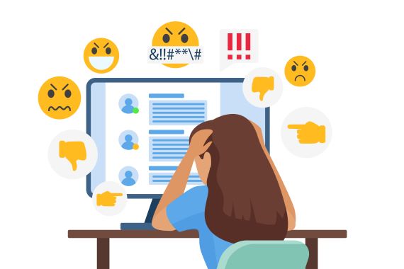 An illustration of a person sitting at a desk looking at a computer with a social media feed and several emojis popping out of the screen, including angry faces, thumbs down, pointing fingers and exclamation marks.