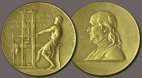 Both sides of the Pulitzer Gold Medal. The front shows a side profile of Benjamin Franklin and the words “Honoris Causa” and “Awarded by Columbia University.” The back side of the medal shows an unidentified man working an old-fashioned hand-printing press.