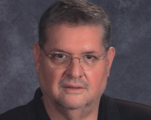 Headshot of Juan Aarmijo.