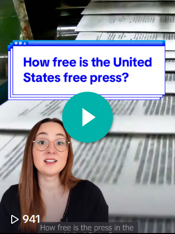 Alexa Volland, Video Producer at the News Literacy Project, midspeech in a screenshot of a TikTok video that says, “How free is the United States free press?” The background shows newspapers on a printing press line.