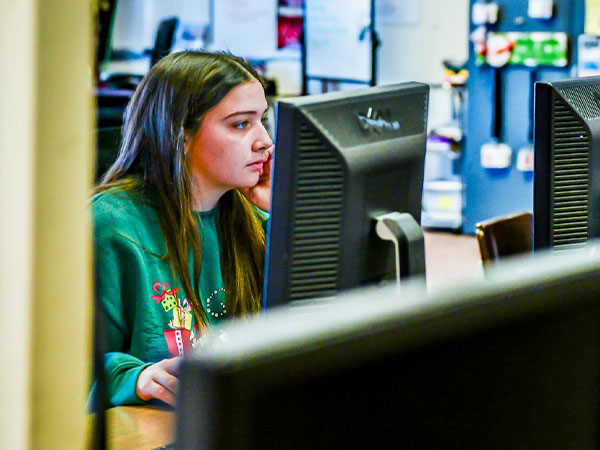 WeirHS-02-600x450 - The News Literacy Project Weirton High School senior and student journalist Hailey Hans works on a project at her computer.